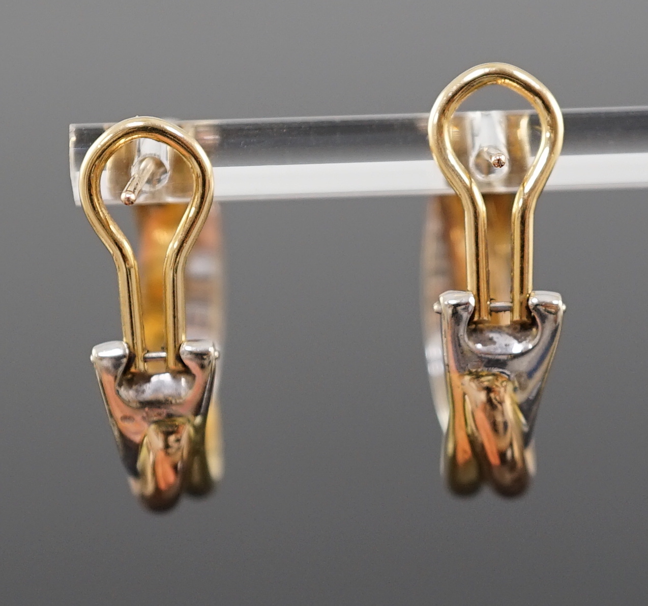 A modern pair of Cartier three colour 18ct gold Trinity earrings